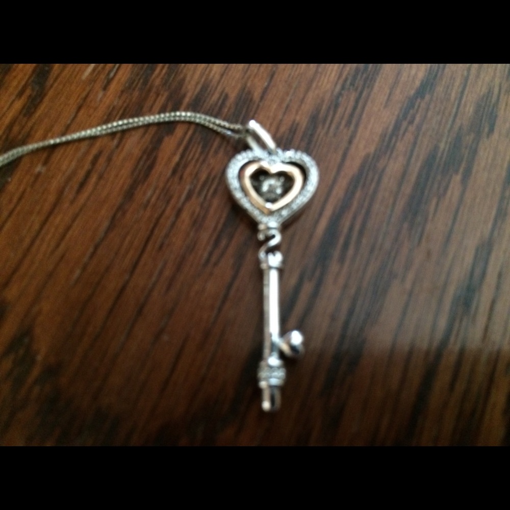 Beautiful Heart key with diamond in the middle.